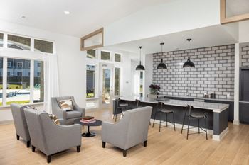 a living room filled with furniture and a large window